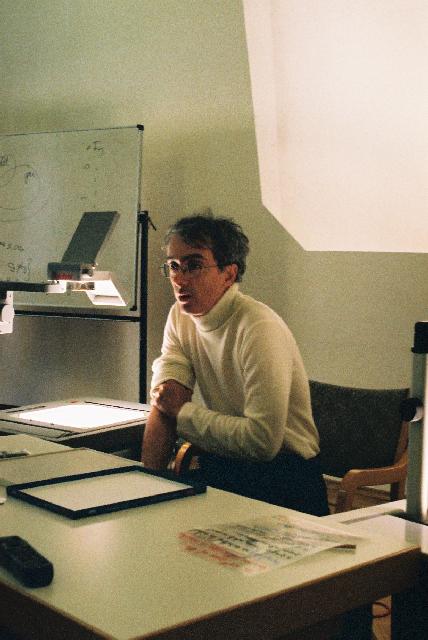 Brenti lecturing at desk